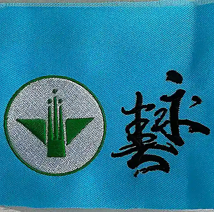 大轉 綠色方向盤交通車隊標誌刺繡 團體服刺繡範例 D&T衣的廠